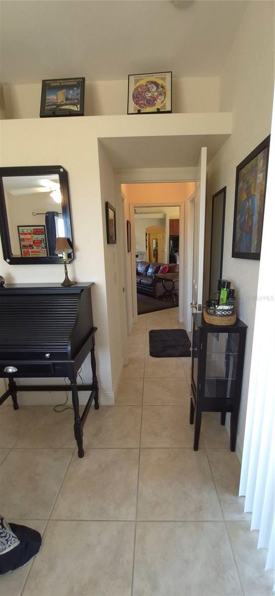 19 Medalist Way, Rotonda West, FL 33947 - hallway featuring light tile patterned floors and baseboards