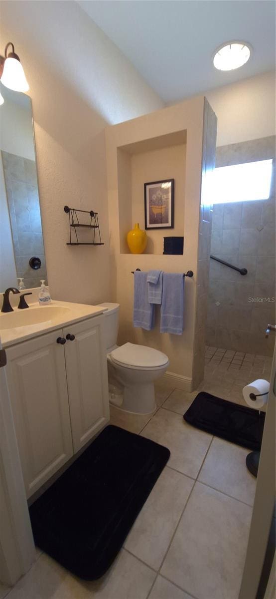 19 Medalist Way, Rotonda West, FL 33947 - bathroom featuring walk in shower, tile patterned floors, toilet, and vanity