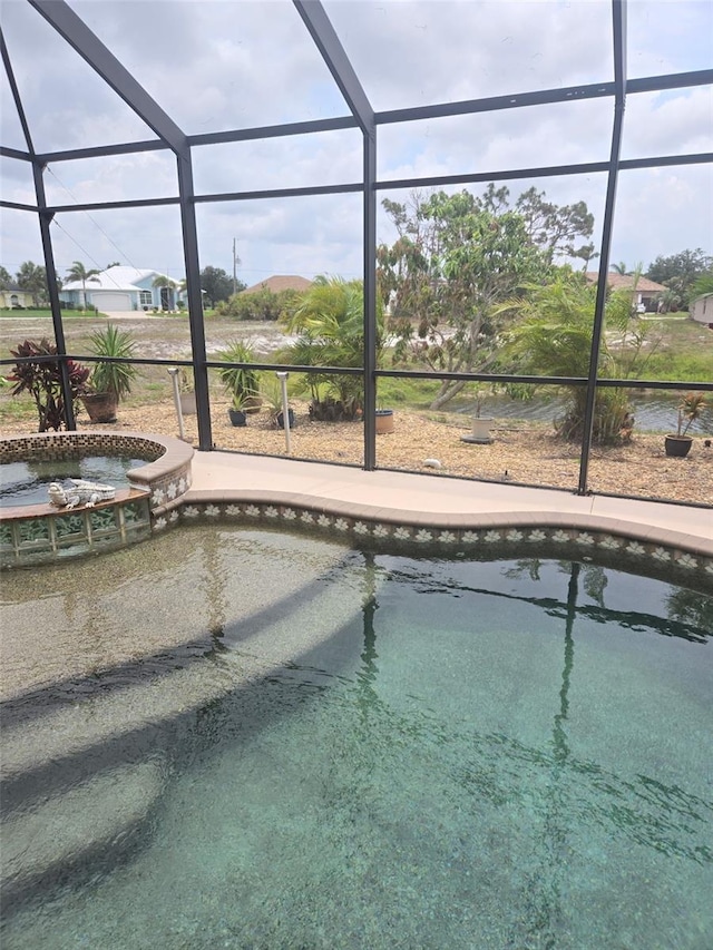 19 Medalist Way, Rotonda West, FL 33947 - outdoor pool featuring an in-ground hot tub and glass enclosure