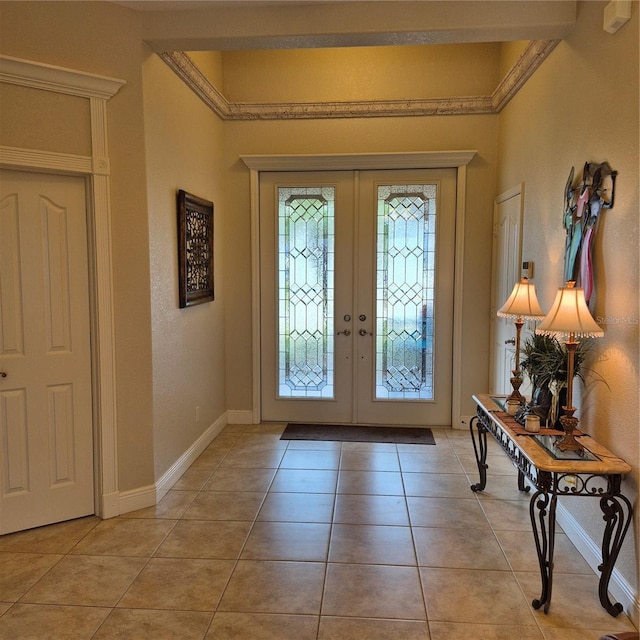 19 Medalist Way, Rotonda West, FL 33947 - entryway with french doors and light tile patterned flooring
