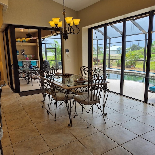 19 Medalist Way, Rotonda West, FL 33947 - dining space featuring light tile patterned floors, plenty of natural light, lofted ceiling, and a chandelier