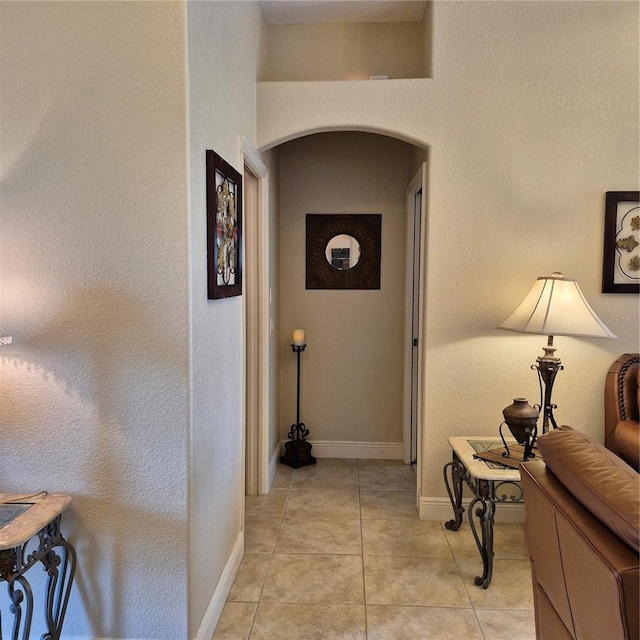 19 Medalist Way, Rotonda West, FL 33947 - hallway with arched walkways and light tile patterned floors