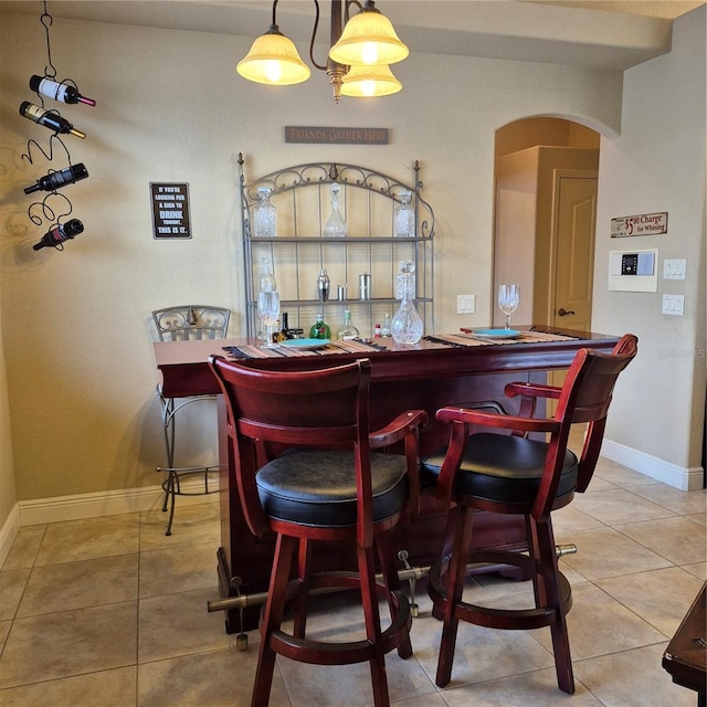 19 Medalist Way, Rotonda West, FL 33947 - indoor dry bar featuring arched walkways and tile patterned floors