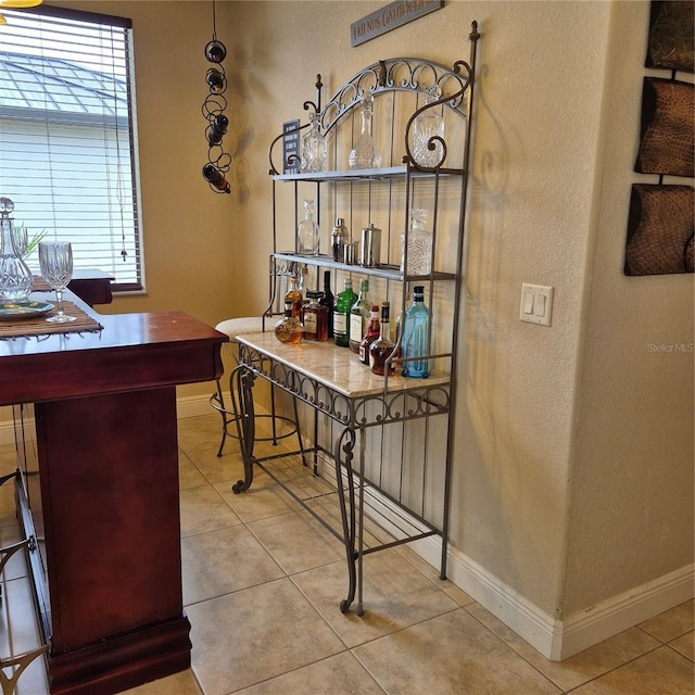 19 Medalist Way, Rotonda West, FL 33947 - office area featuring tile patterned floors, healthy amount of natural light, and a textured wall