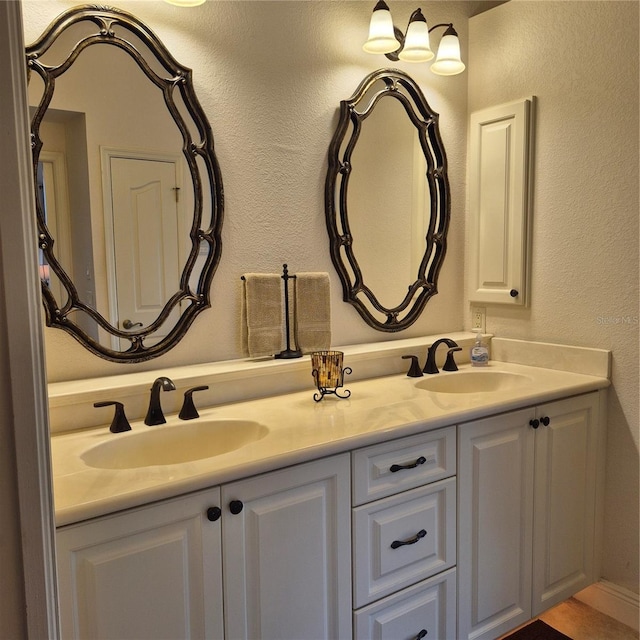 19 Medalist Way, Rotonda West, FL 33947 - bathroom with double vanity and a textured wall