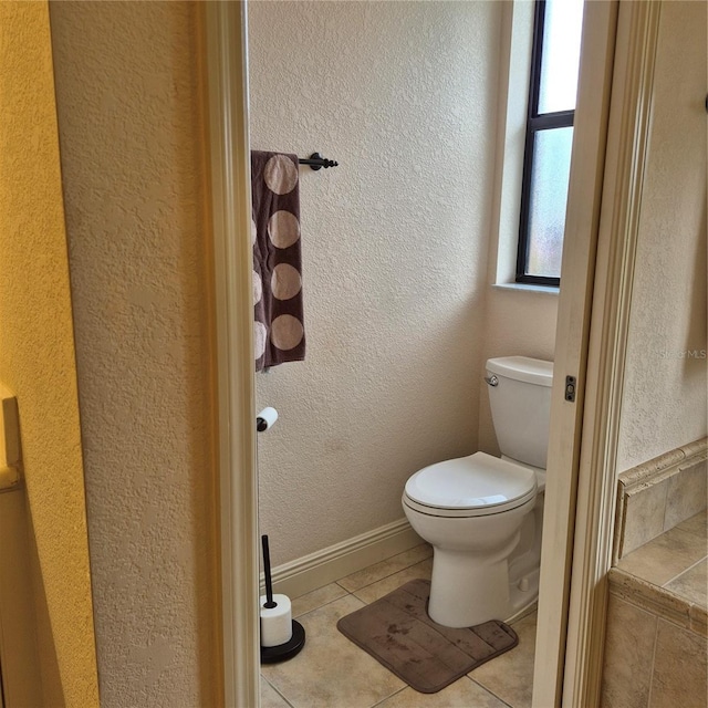 19 Medalist Way, Rotonda West, FL 33947 - bathroom featuring tile patterned floors and a textured wall