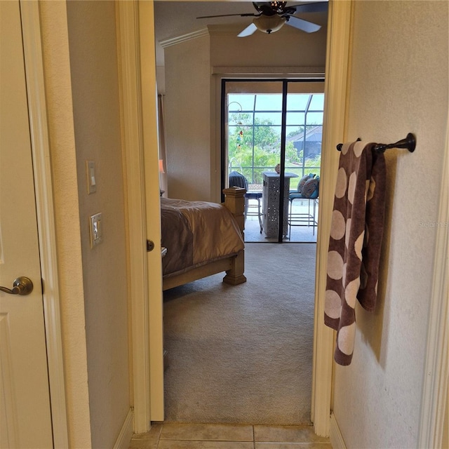 19 Medalist Way, Rotonda West, FL 33947 - bedroom with light colored carpet, access to outside, and light tile patterned flooring