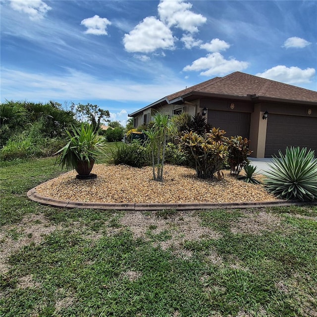 19 Medalist Way, Rotonda West, FL 33947 - view of yard with a garage
