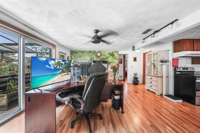857 Palmetto St, Englewood, FL 34223 - office space with light wood-type flooring, ceiling fan, and rail lighting