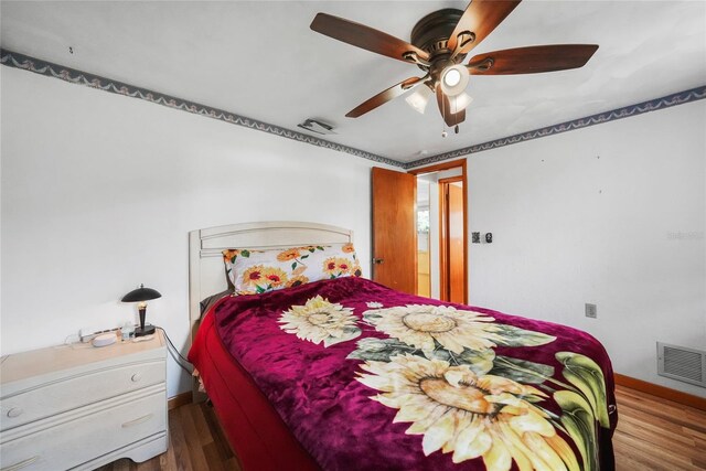 857 Palmetto St, Englewood, FL 34223 - bedroom with baseboards, wood finished floors, and ceiling fan