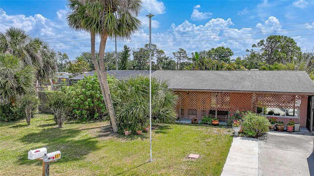 857 Palmetto St, Englewood, FL 34223 - view of front facade with a front lawn