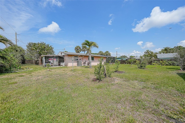 857 Palmetto St, Englewood, FL 34223 - view of yard with a sunroom
