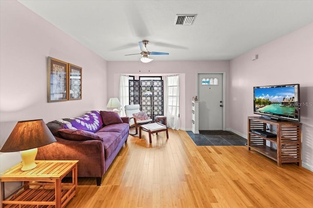 7180 Quarry St, Englewood, FL 34224 - living room with light wood-type flooring, ceiling fan, and baseboards