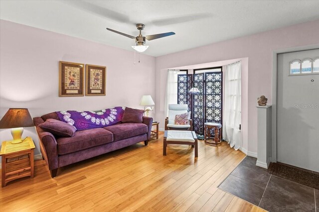 7180 Quarry St, Englewood, FL 34224 - living room featuring wood finished floors, ceiling fan, and baseboards