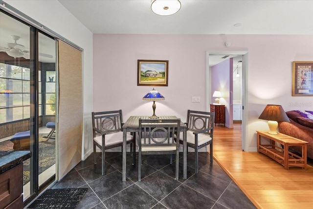 7180 Quarry St, Englewood, FL 34224 - dining space featuring baseboards and dark tile patterned flooring