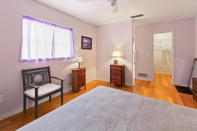 7180 Quarry St, Englewood, FL 34224 - bedroom featuring wood finished floors, baseboards, a ceiling fan, and a textured ceiling