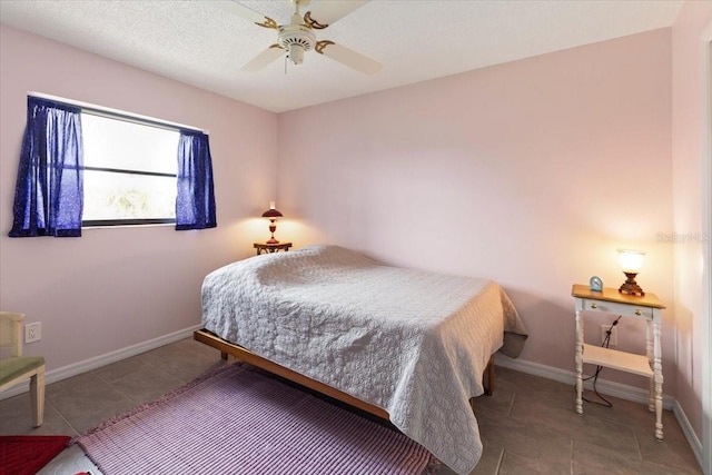 7180 Quarry St, Englewood, FL 34224 - bedroom featuring tile patterned flooring, baseboards, and a ceiling fan