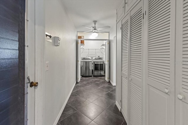 7180 Quarry St, Englewood, FL 34224 - hall with separate washer and dryer, baseboards, and dark tile patterned flooring
