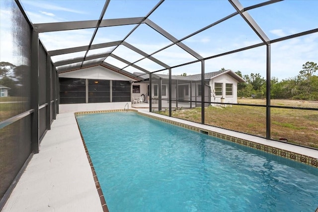 7180 Quarry St, Englewood, FL 34224 - swimming pool with a lawn, glass enclosure, and a patio