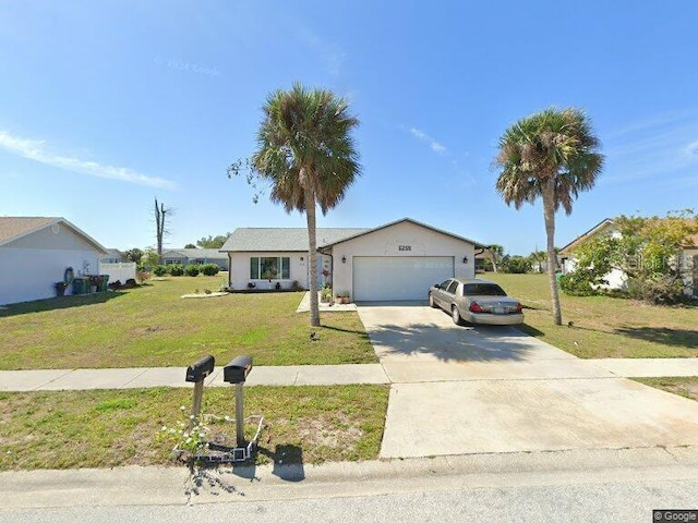 ranch-style house with an attached garage, a front lawn, and driveway
