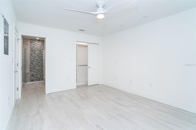 2700 N Beach Rd Unit A201, Englewood, FL 34223 - unfurnished bedroom with ceiling fan, a closet, and baseboards