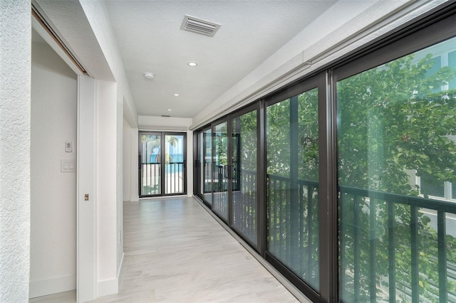2700 N Beach Rd Unit A201, Englewood, FL 34223 - hall featuring wood finished floors and baseboards