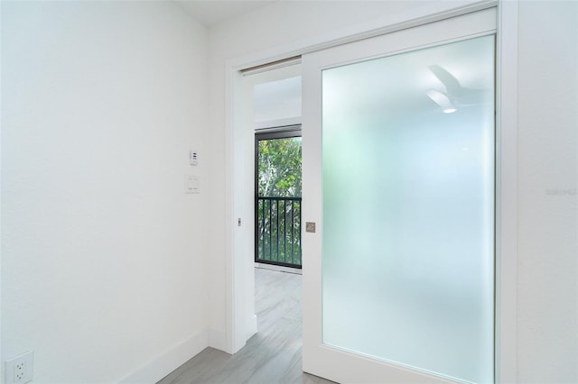 2700 N Beach Rd Unit A201, Englewood, FL 34223 - hall with baseboards and light wood finished floors