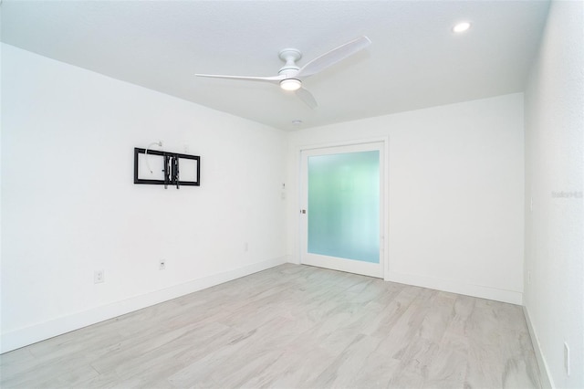 2700 N Beach Rd Unit A201, Englewood, FL 34223 - empty room featuring baseboards, a ceiling fan, and light wood-style flooring