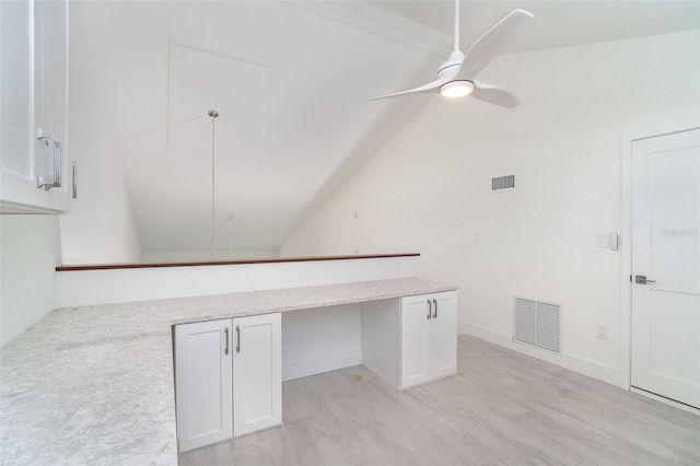 2700 N Beach Rd Unit A201, Englewood, FL 34223 - interior space featuring ceiling fan, vaulted ceiling, an office area, white cabinetry, and a peninsula