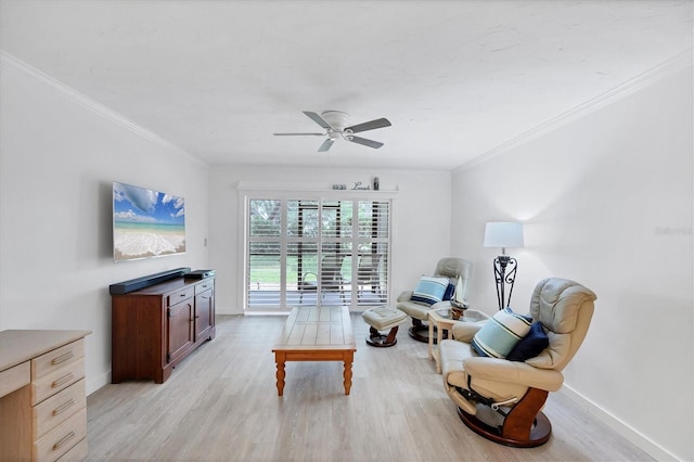 149 Englewood Isles Parkway Unit 603, Englewood, FL 34223 - sitting room featuring a ceiling fan, light wood-style flooring, crown molding, and baseboards
