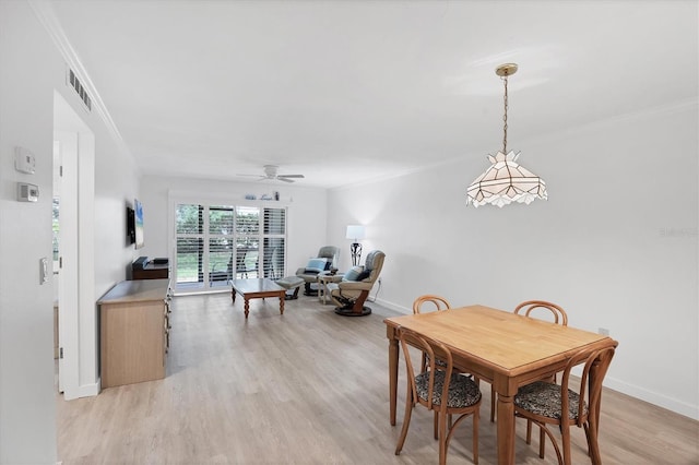 149 Englewood Isles Parkway Unit 603, Englewood, FL 34223 - dining area featuring crown molding, light wood finished floors, baseboards, and ceiling fan