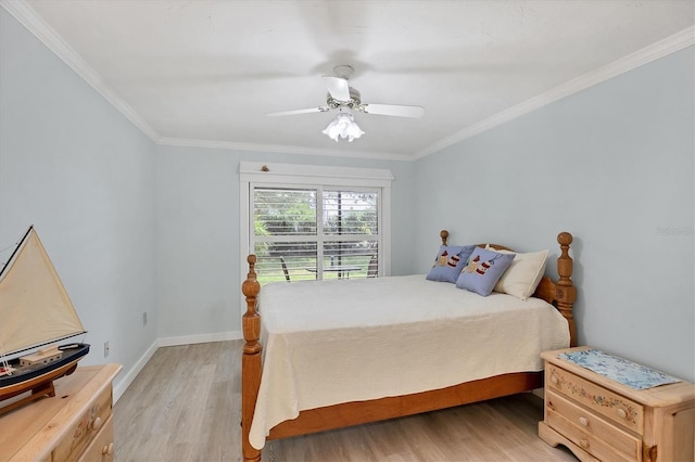 149 Englewood Isles Parkway Unit 603, Englewood, FL 34223 - bedroom with light wood-style floors, crown molding, ceiling fan, and baseboards