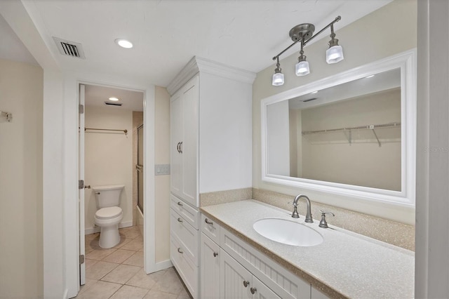 149 Englewood Isles Parkway Unit 603, Englewood, FL 34223 - bathroom featuring toilet, tile patterned flooring, vanity, a spacious closet, and recessed lighting