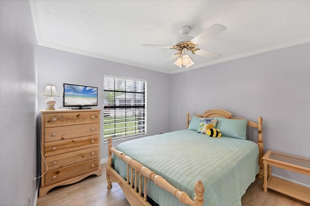 149 Englewood Isles Parkway Unit 603, Englewood, FL 34223 - bedroom with wood finished floors, ornamental molding, a ceiling fan, and baseboards