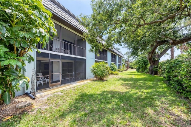 149 Englewood Isles Parkway Unit 603, Englewood, FL 34223 - view of grassy yard featuring a sunroom