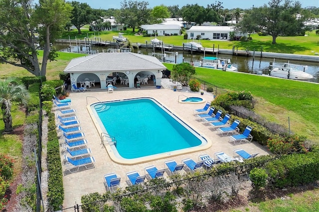 149 Englewood Isles Parkway Unit 603, Englewood, FL 34223 - community pool featuring a patio and a water view