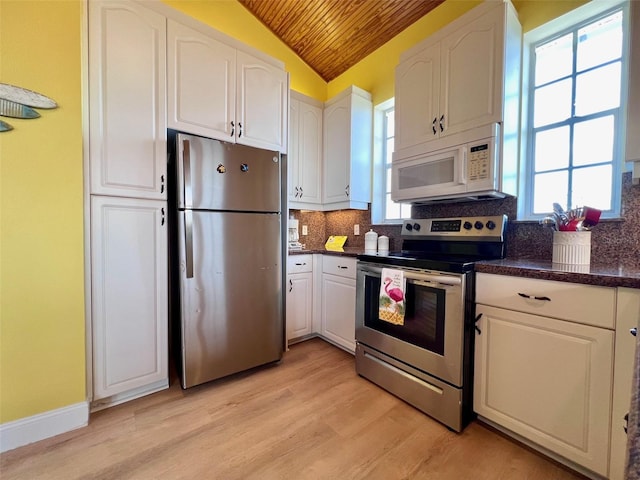 9594 Doubloon Trl, Placida, FL 33946 - kitchen featuring stainless steel appliances, wooden ceiling, lofted ceiling, white cabinets, and light wood finished floors