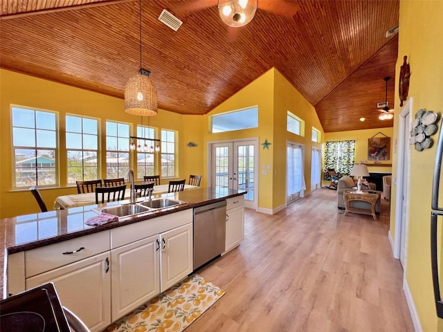 9594 Doubloon Trl, Placida, FL 33946 - kitchen featuring stainless steel dishwasher, wooden ceiling, white cabinetry, high vaulted ceiling, and french doors