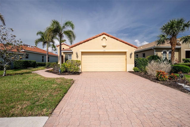 142 Savona Way N, Venice, FL 34275 - mediterranean / spanish-style home featuring decorative driveway, stucco siding, a tile roof, a garage, and a front lawn