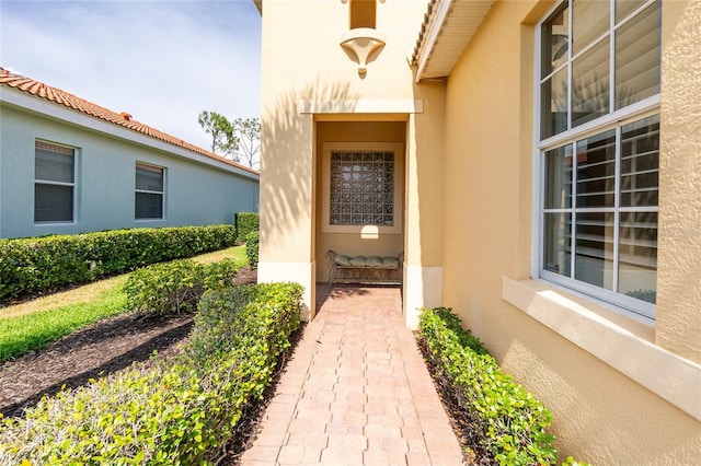 142 Savona Way N, Venice, FL 34275 - property entrance with stucco siding