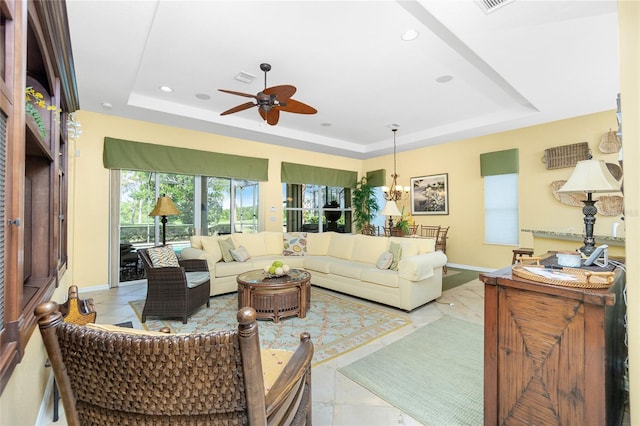 142 Savona Way N, Venice, FL 34275 - living room featuring a raised ceiling, a ceiling fan, baseboards, recessed lighting, and light marble finish floors