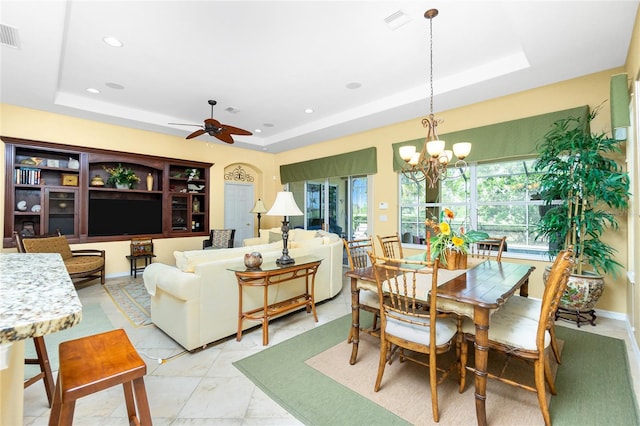 142 Savona Way N, Venice, FL 34275 - dining space featuring a tray ceiling, a chandelier, ceiling fan, and recessed lighting
