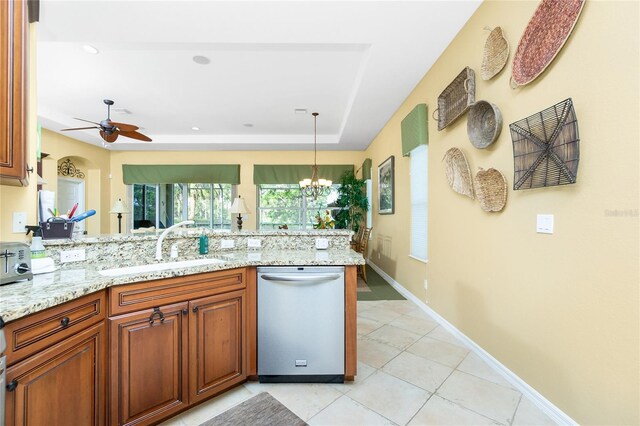 142 Savona Way N, Venice, FL 34275 - kitchen featuring stainless steel dishwasher, a peninsula, a sink, ceiling fan, and light tile patterned flooring