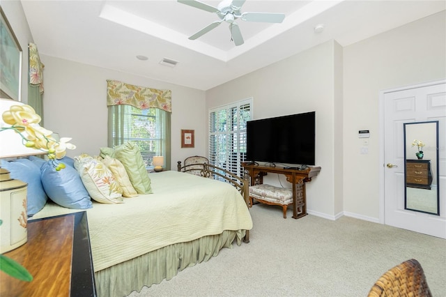 142 Savona Way N, Venice, FL 34275 - carpeted bedroom with a ceiling fan, a raised ceiling, and baseboards