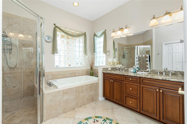 142 Savona Way N, Venice, FL 34275 - bathroom featuring a garden tub, a shower stall, double vanity, and tile patterned floors