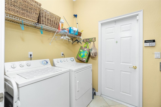 142 Savona Way N, Venice, FL 34275 - clothes washing area featuring washing machine and clothes dryer and light tile patterned floors