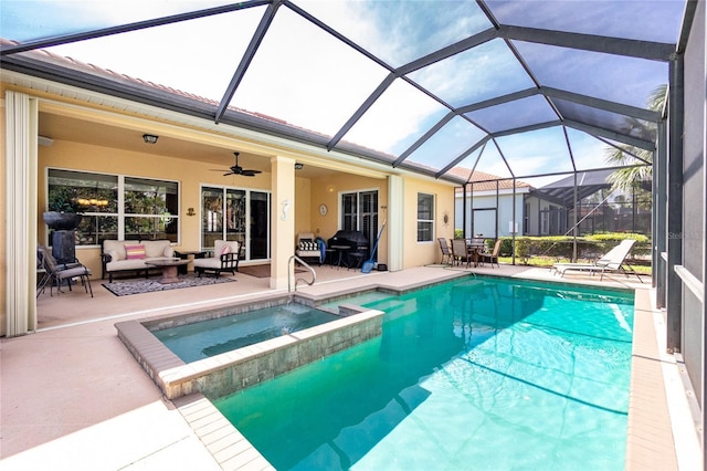 142 Savona Way N, Venice, FL 34275 - view of pool featuring an outdoor hangout area, a patio area, a ceiling fan, a pool with connected hot tub, and glass enclosure