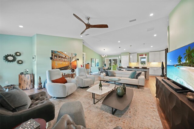171 Mark Twain Ln, Rotonda West, FL 33947 - living area featuring light wood-style flooring, a ceiling fan, lofted ceiling, and recessed lighting