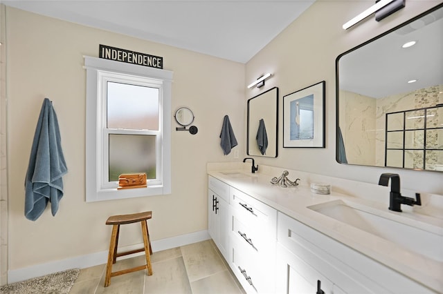 171 Mark Twain Ln, Rotonda West, FL 33947 - bathroom featuring double vanity, a shower, and baseboards