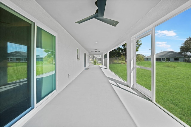 171 Mark Twain Ln, Rotonda West, FL 33947 - unfurnished sunroom featuring a ceiling fan and healthy amount of natural light